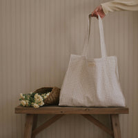 Sac vichy sur un banc