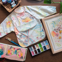 Bavette à manches longues avec pochette intégrée